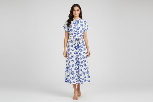 White dress with blue floral pattern on a white background