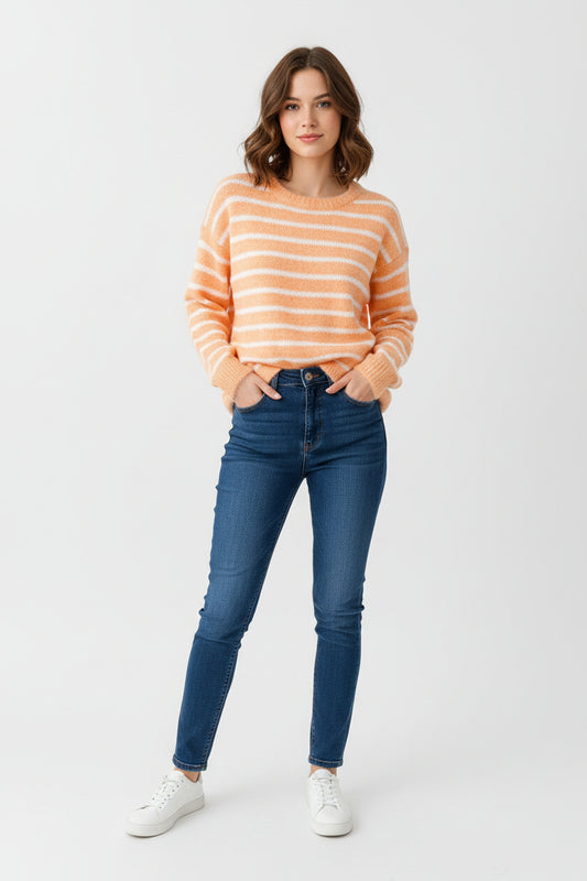 Orange and white striped sweater on a hanger against a white background